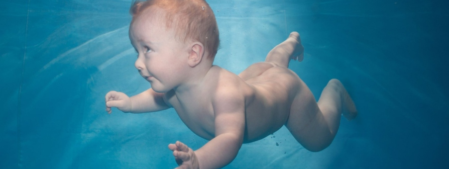 child swimming underwater